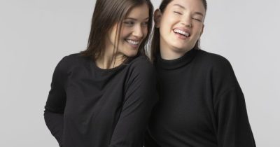 two-girls-wearing-black-t-shirt-posing-studio